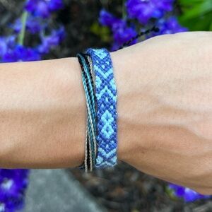 Handmade blue woven bracelet tie on